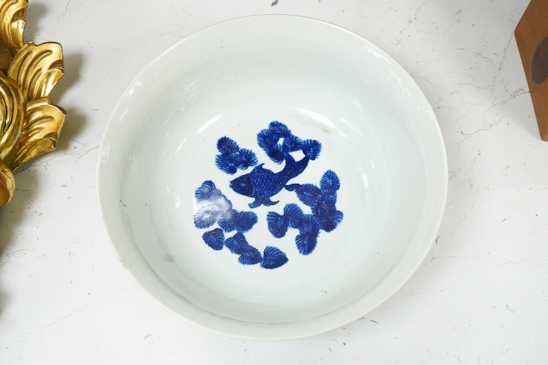 A Chinese blue and white dragon bowl, Kangxi mark but later, 26cm diameter